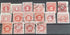 A collection of vintage red US postage due stamps with various denominations.