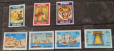 A set of vintage Bangladesh postage stamps displayed in a row, showcasing various designs including portraits and images of animals and flowers.
