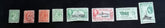 A set of vintage Falkland Islands stamps from various reigns, displayed in a row.