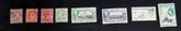 A set of vintage Falkland Islands stamps from various reigns, displayed in a row.