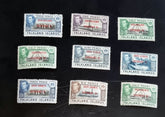 A set of vintage Falkland Islands stamps from various reigns, displayed in a row.