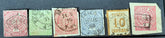 A selection of vintage German stamps from various regions and periods, displayed in a row.
