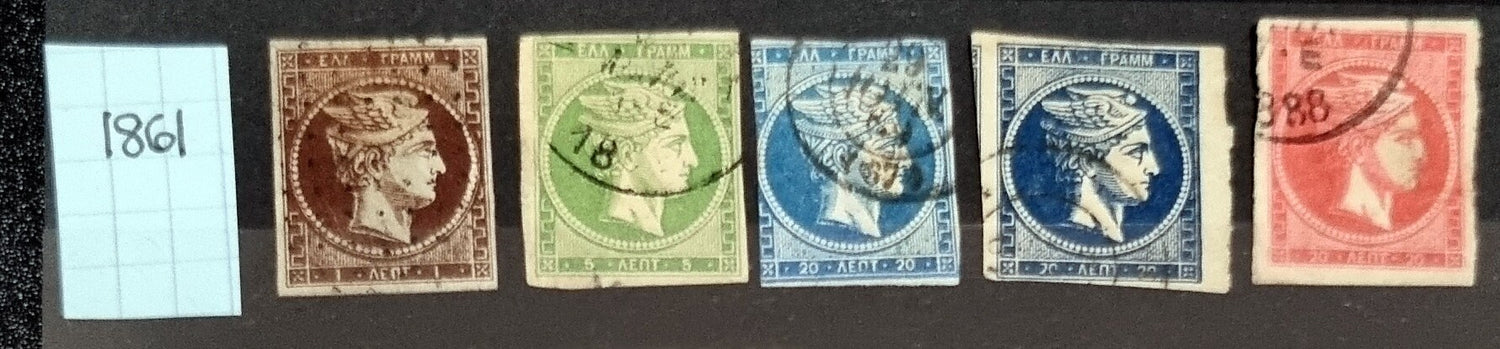A collection of vintage Greek stamps, featuring different designs and colors, arranged side by side.