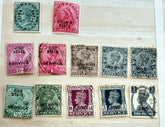 A collection of various Indian postage stamps displayed in a row, showcasing different colors and designs.