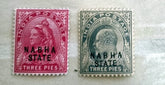 A collection of various Indian postage stamps displayed in a row, showcasing different colors and designs.