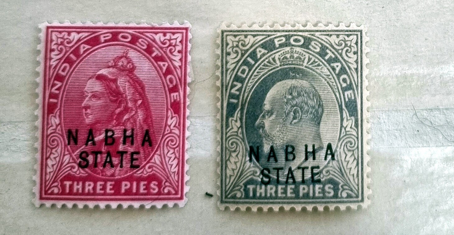 A collection of various Indian postage stamps displayed in a row, showcasing different colors and designs.