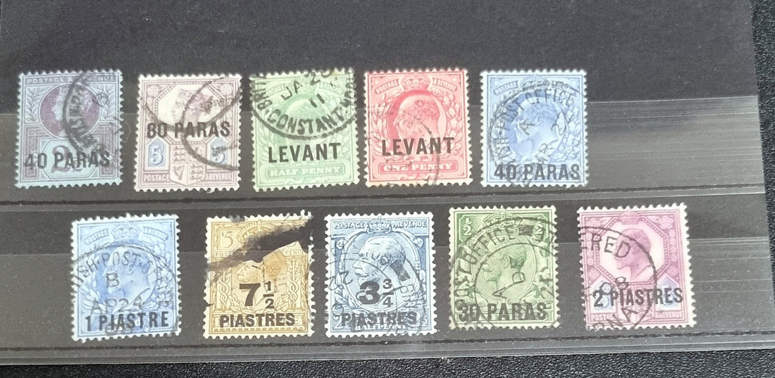 A collection of vintage postage stamps from the Levant, featuring various colors and designs, some with post marks.