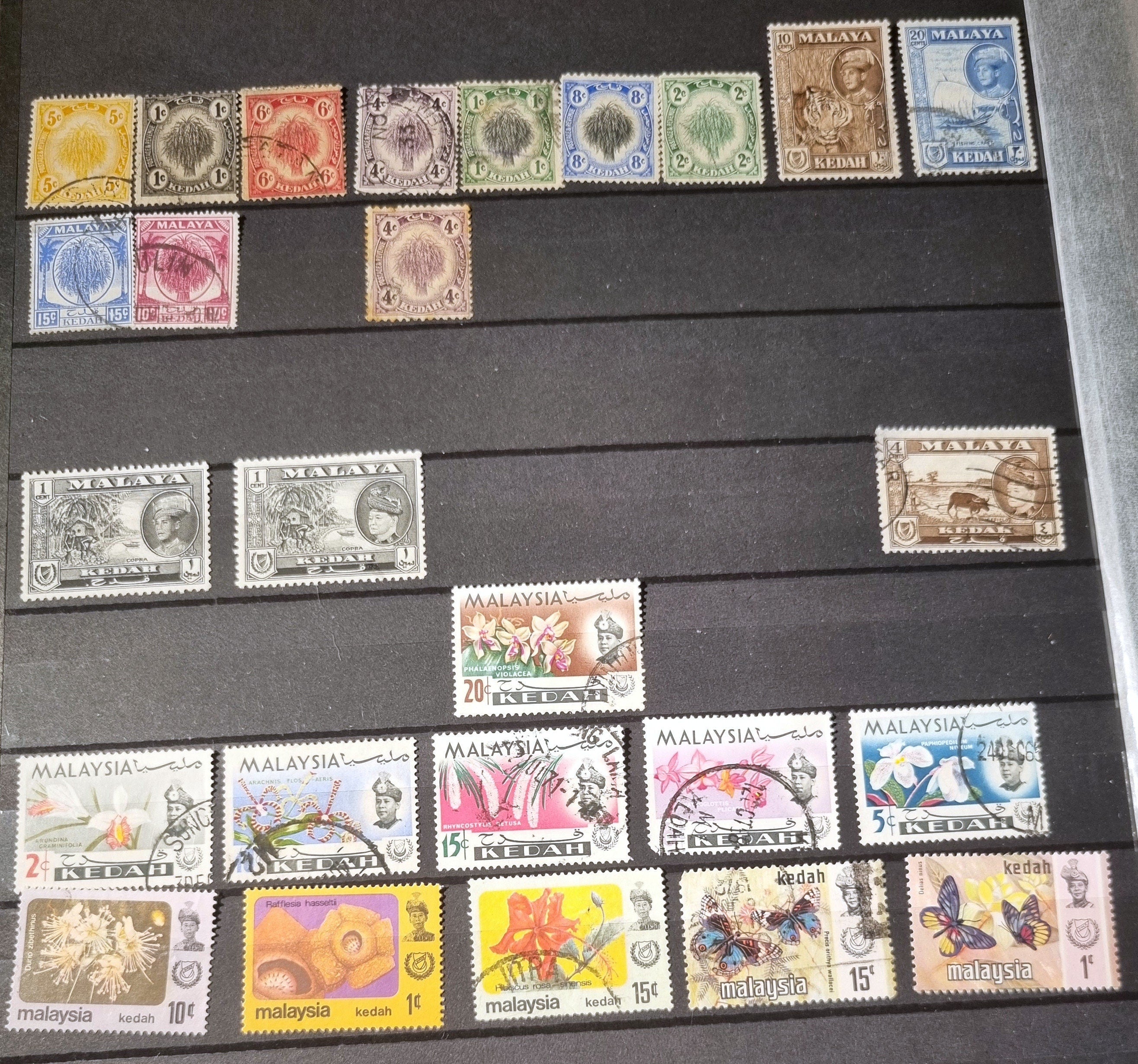 A collection of various vintage Malay state stamps 