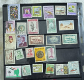 A collection of various postage stamps from different Arab countries displayed in a row, each with different designs and colors.