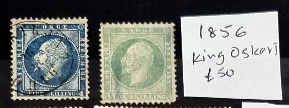 A collection of vintage Norwegian stamps featuring portraits of the Norwegian king, with a focus on stamps from the early 20th century.