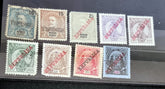 A collection of vintage Portuguese and colonies stamps displayed fanned out on a surface, featuring various designs and denominations.