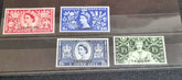 A collection of various vintage Tangier postage stamps displayed on a surface, with different colors and designs, including portraits of a king and a queen.